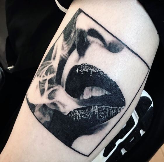Darl Papple photorealism tattoo artist in Michigan lip portrait sexy smoking