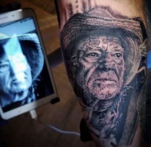 Willie Nelson portrait tattoo by Darl Papple from The Shop in Fowlerville